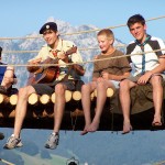 Scouts playing a guitar